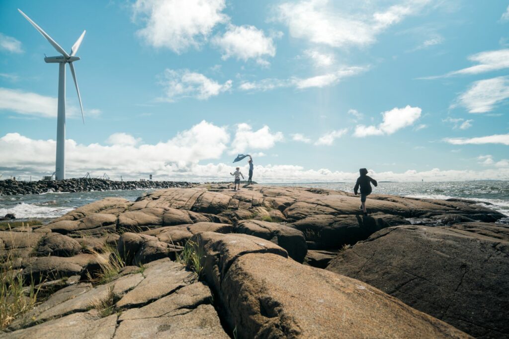 People on a rocky beach in Reposaari