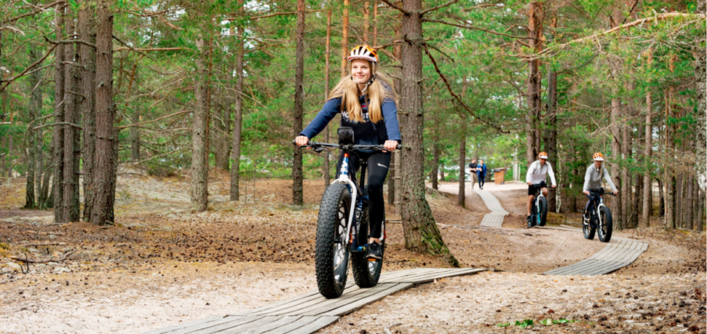 girl cycling on a path