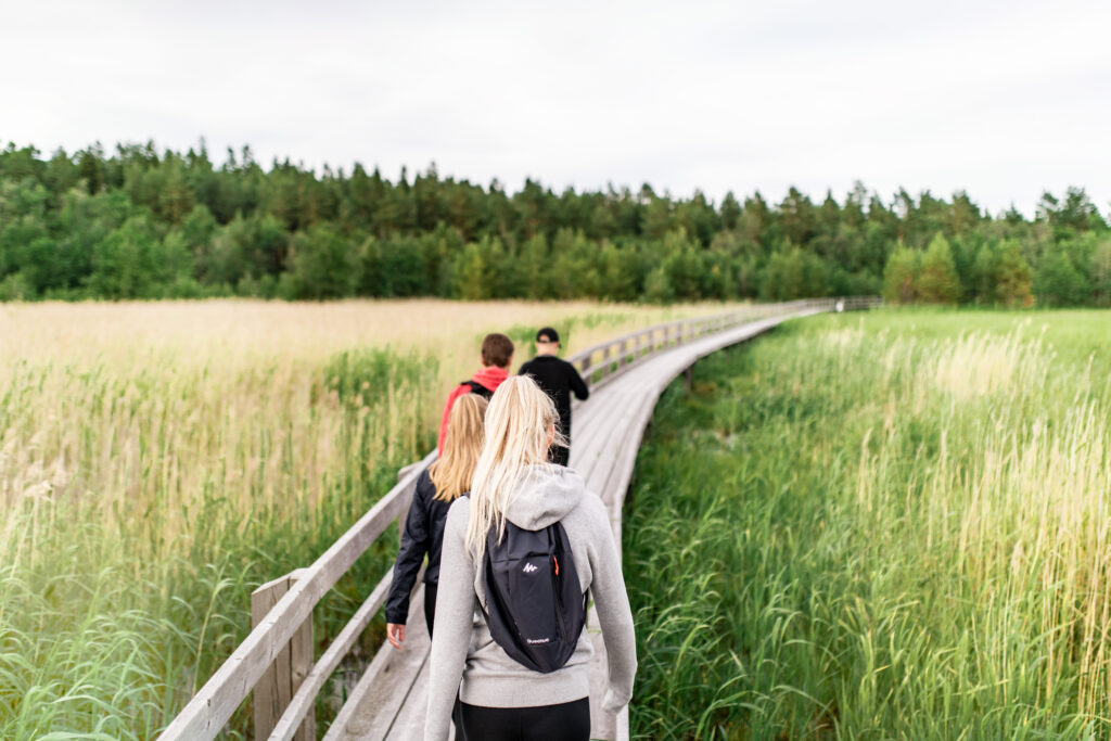 A family walking on a hiking trail