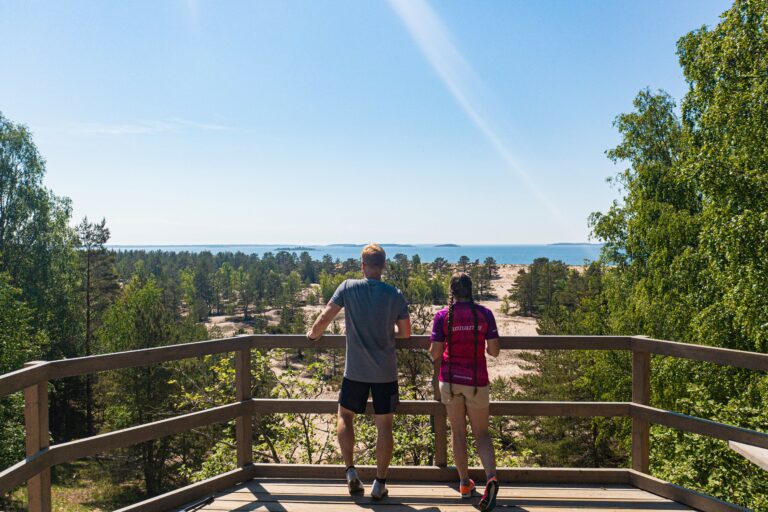 Two people admiring the sea view on an observation deck in Yyteri.