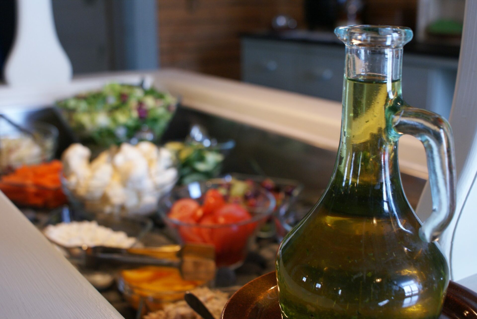 Lunch café Harjun tupa with salad table and a bottle of oil